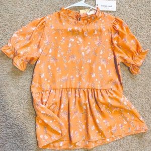 Brand new, tags still on it! Really adorable blouse from a boutique!!